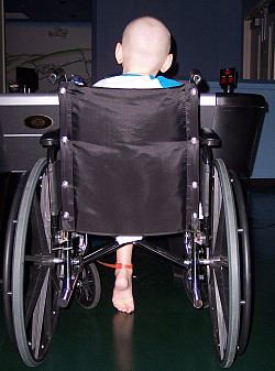 Truman in a wheelchair after surgery